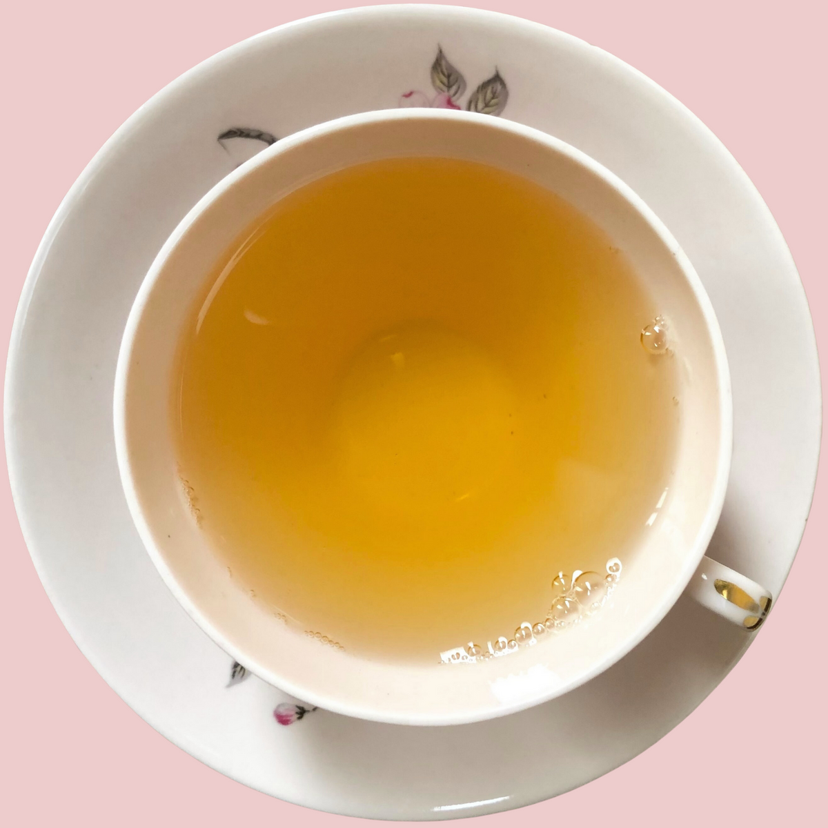 Golden cup of Darjeeling First Flush tea with floral aroma liquor by ArtTeas® 