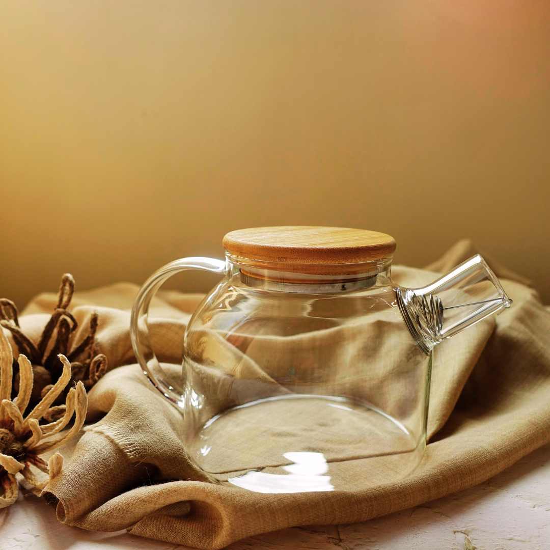  ArtTeas® 1 litre glass teapot with wooden lid and stainless steel infuser on neutral fabric backdrop