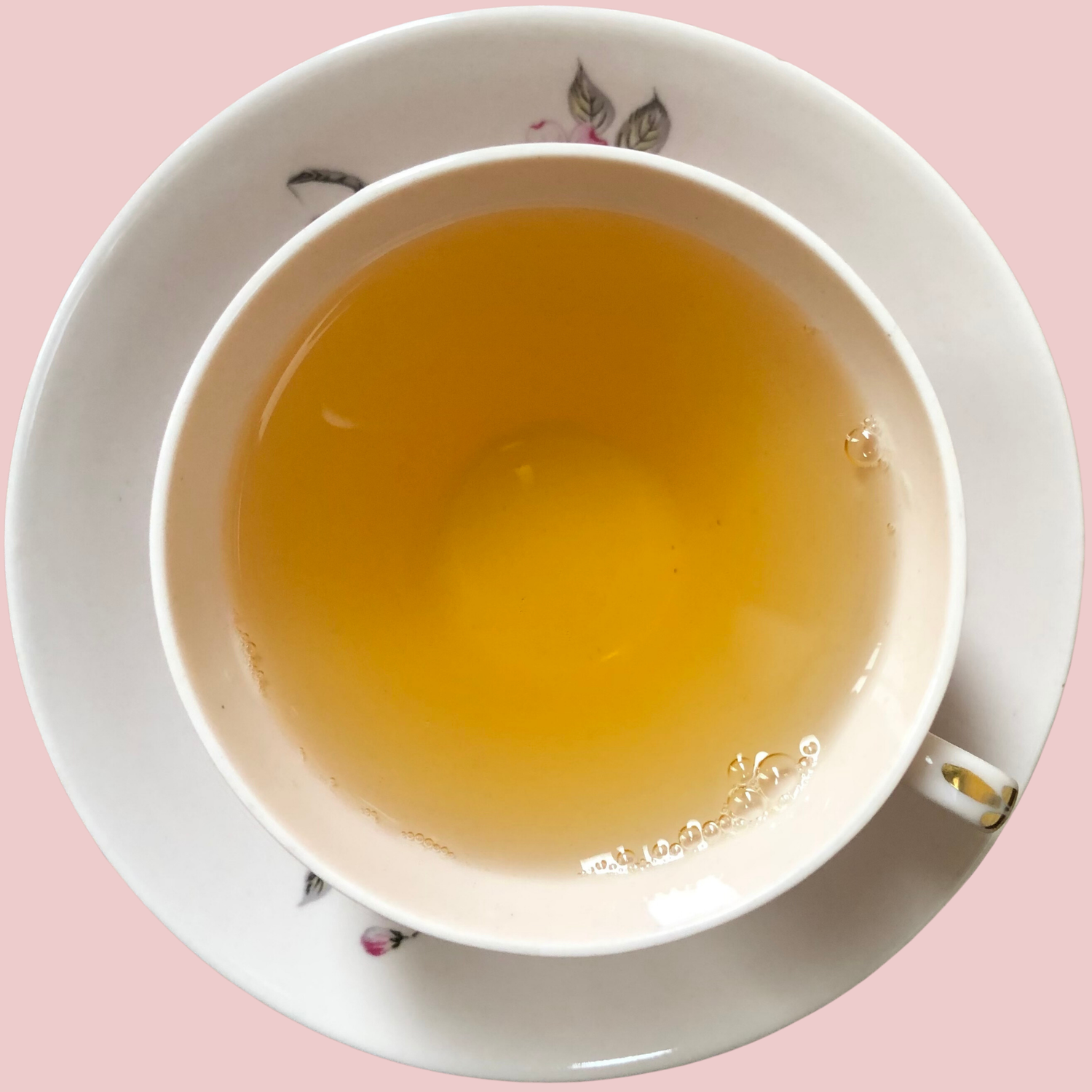 Brewed Jasmine Pearls green tea with golden liquor