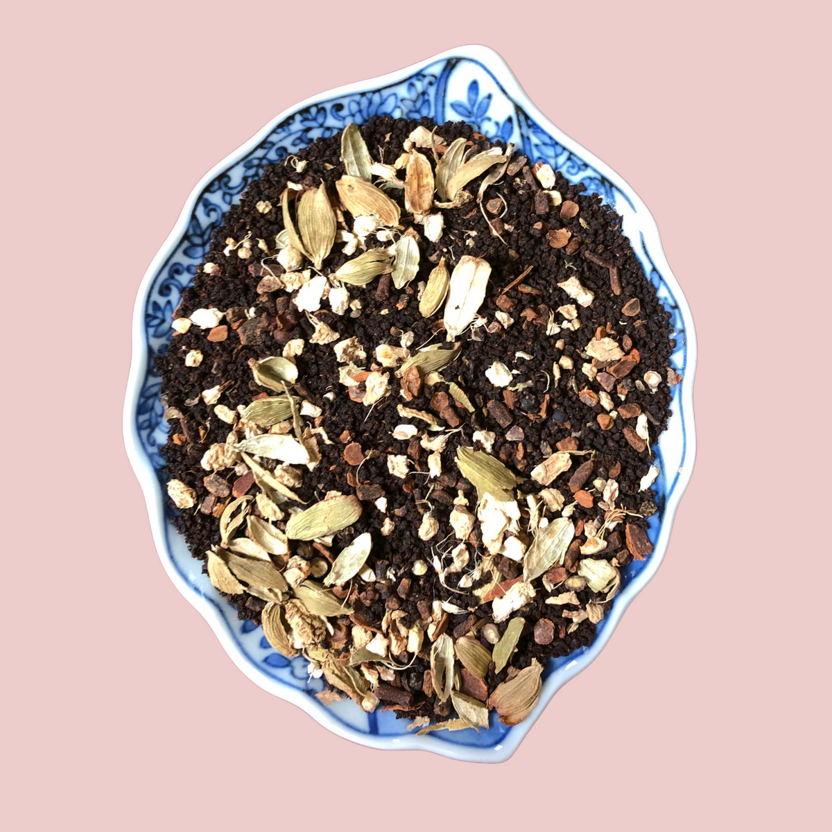 Close-up of loose leaf Assam Masala Chai blend with whole spices including cardamom, cinnamon and cloves