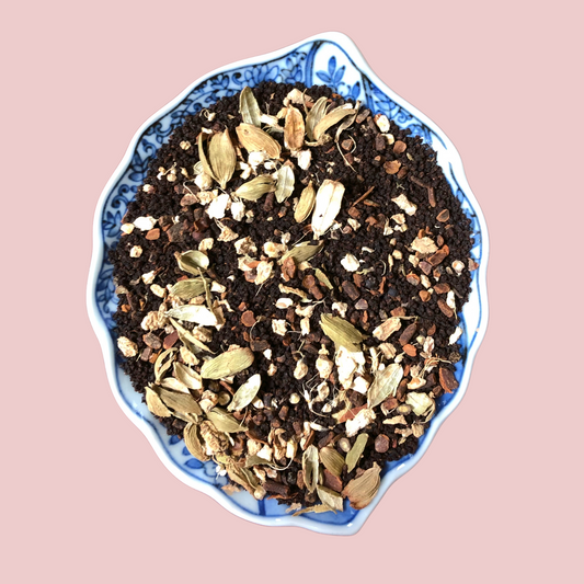 Close-up of loose leaf Assam Masala Chai blend with whole spices including cardamom, cinnamon and cloves