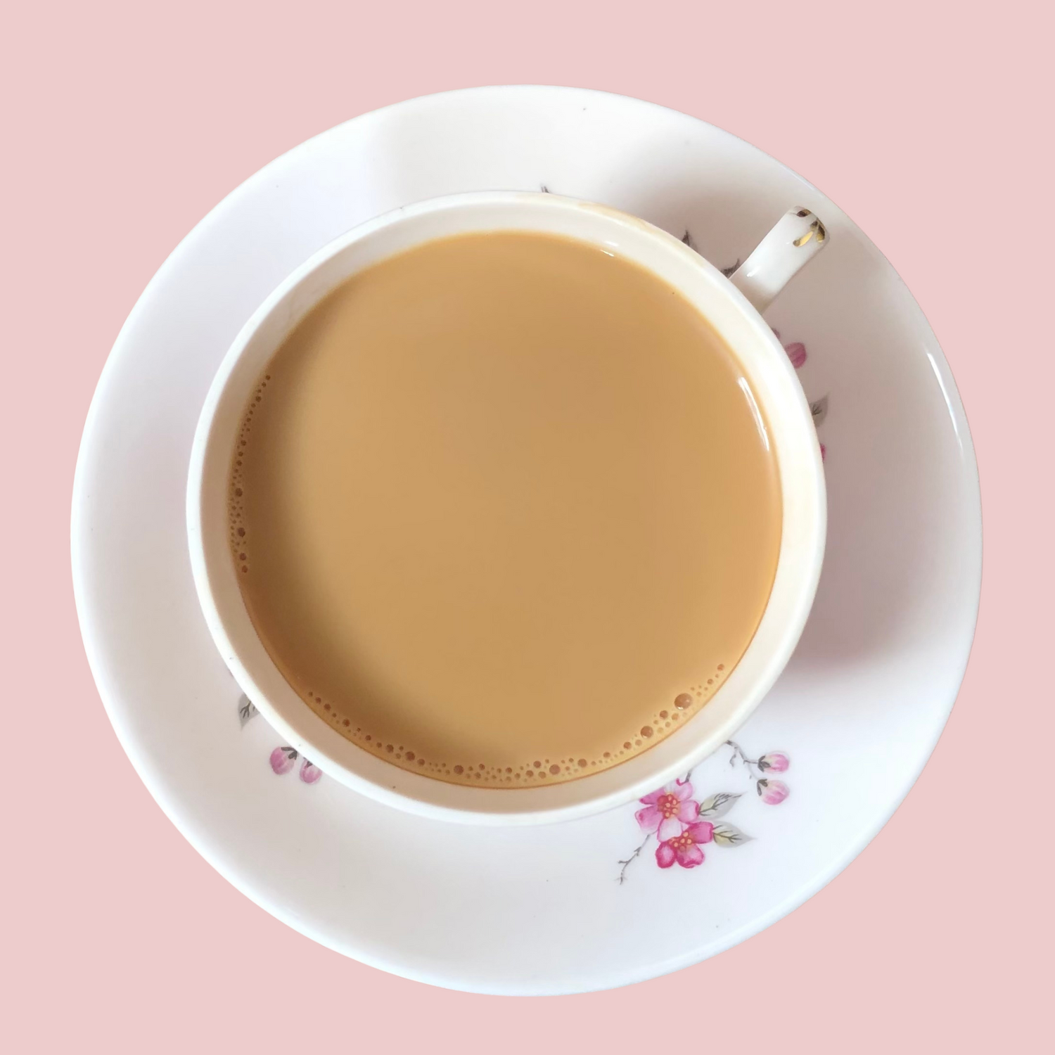 Freshly brewed Assam Darjeeling tea blend with rich amber liquor in a teacup by ArtTeas® 