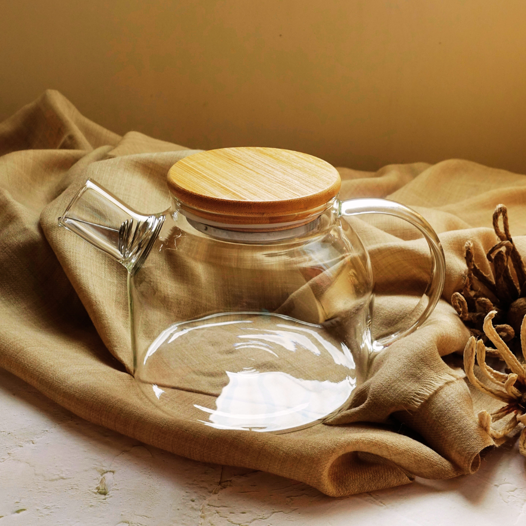 Elegant glass teapot with wooden lid styled for tea brewing and serving -  ArtTeas®