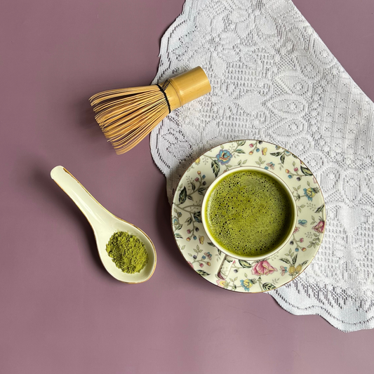 Cup of lemongrass ginger green tea with vibrant green infusion