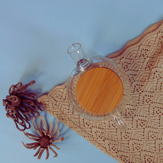 Top view of clear glass teapot with wooden lid showcasing minimalist design -  ArtTeas® India
