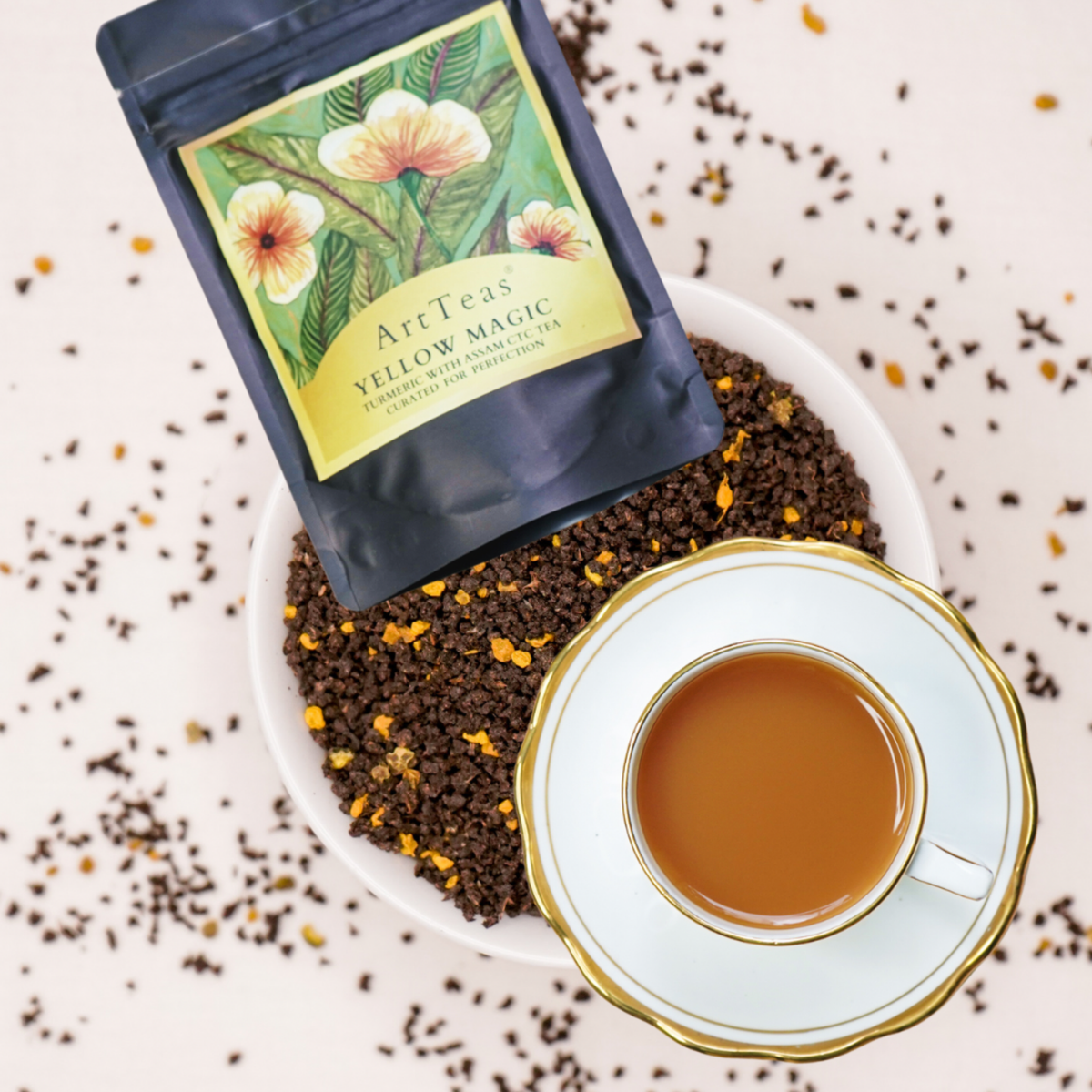 ArtTeas® yellow Magic Turmeric Pepper Assam CTC tea pouch with watercolor botanical flower artwork on label — wellness tea gift India


