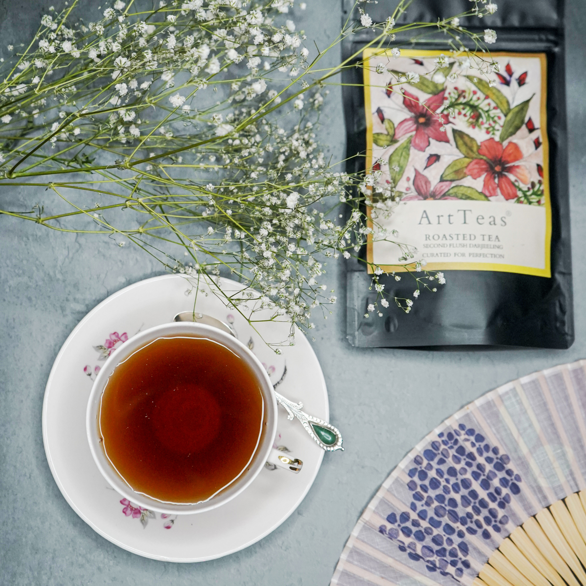 ArtTeas® roasted Darjeeling tea packaging with botanical artwork