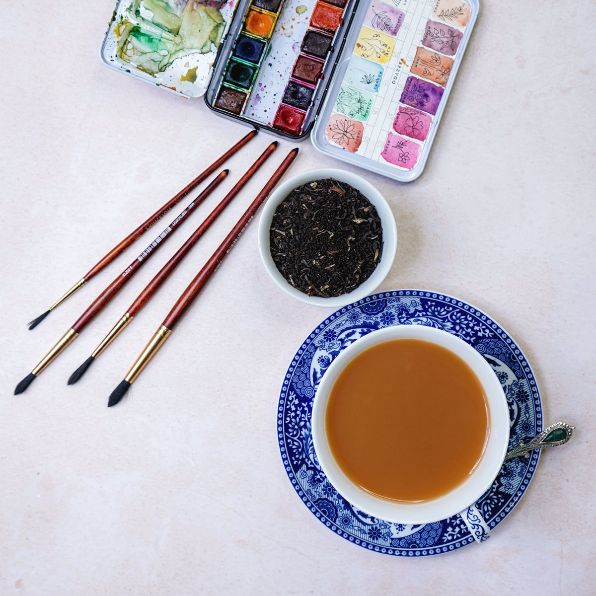 ArtTeas® Melody styled with watercolor paintbrushes and china cup  - artisan Assam Darjeeling blend India 