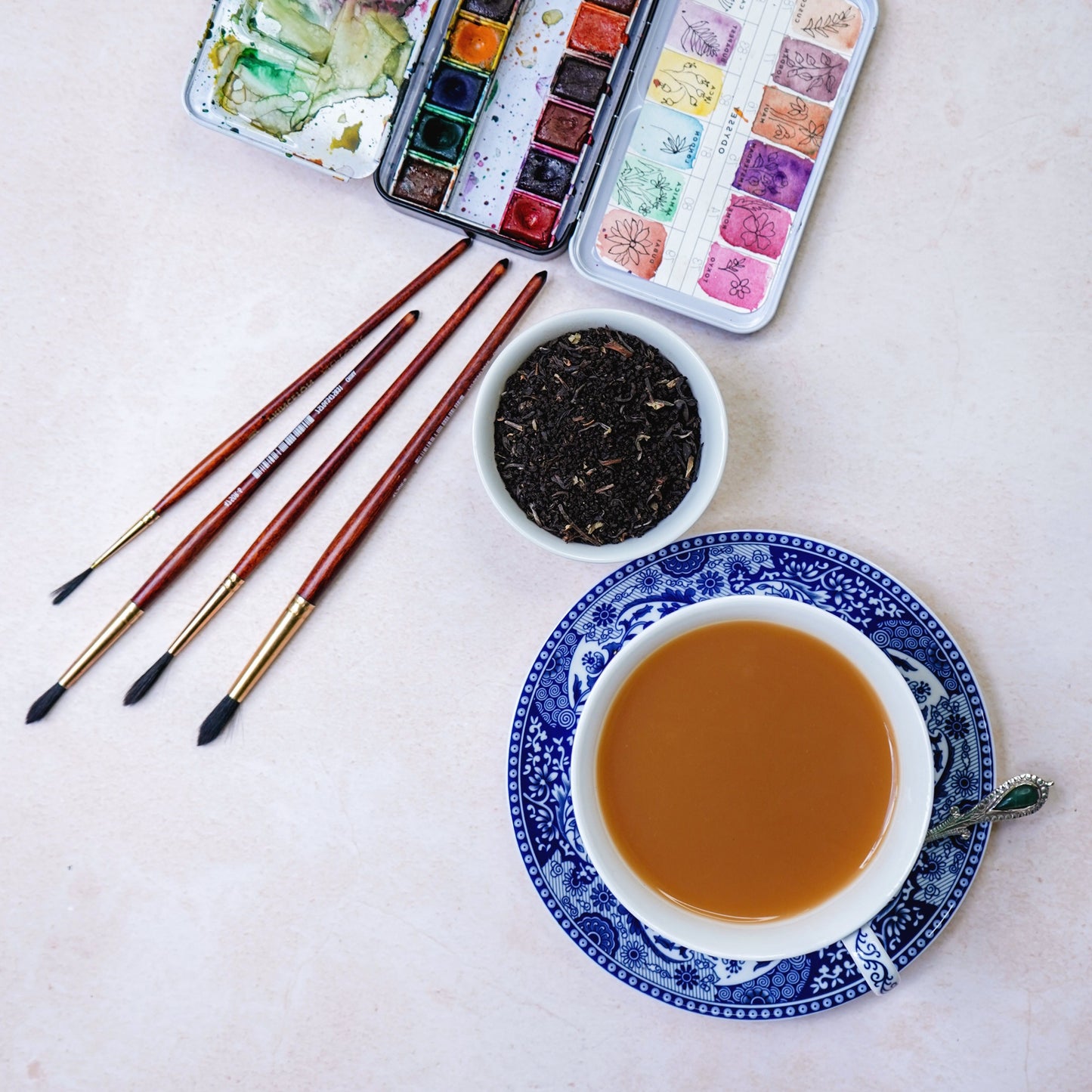 ArtTeas® Melody styled with watercolor paintbrushes and china cup  - artisan Assam Darjeeling blend India 